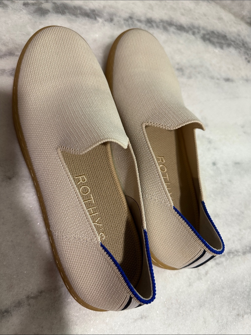 Rothy's Women's Slip-On Sneakers in Cream with Blue Trim